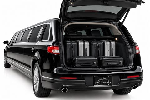 Stretch limousine trunk holding 4 large suitcases and 2 carry-ons